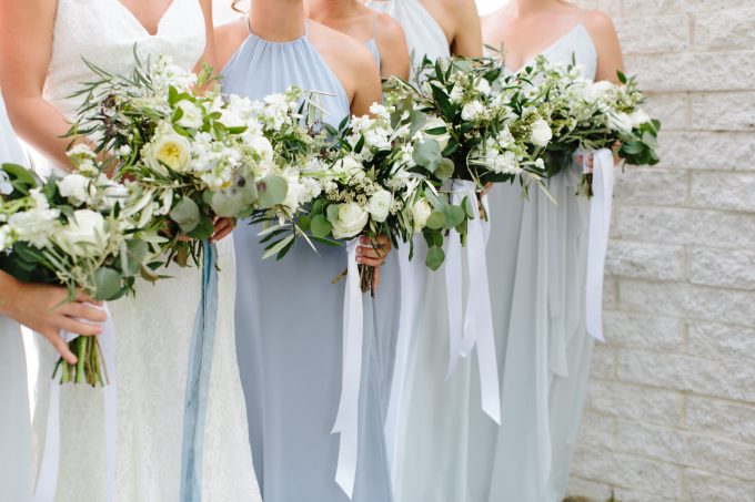 Wedding party bouquets and bridal bouquet with flowing ribbons