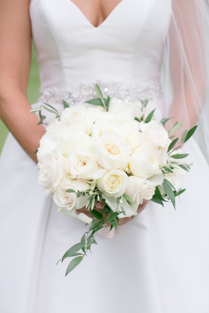 bridal bouquet in white with touches of greenery